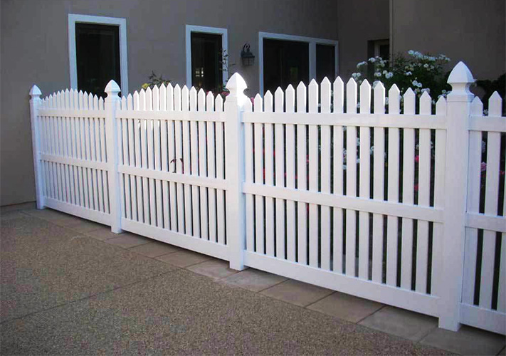 White scalloped picket fencing, an example of our Sherman Oaks premium PVC fences.