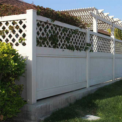 Privacy fencing with lattice top from our Empire vinyl gate fabricators.