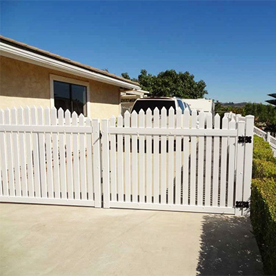 White picket vinyl gate supplied in Earlimart, California by Vinyl Craft.