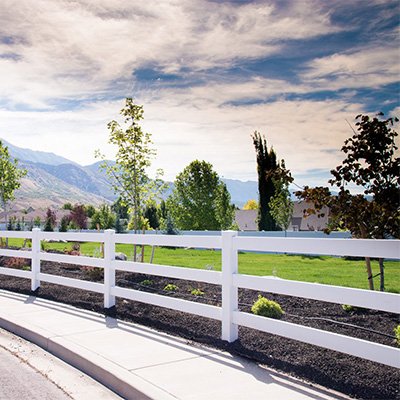 White three-rail ranch rail fence, one of our many choices for wholesale vinyl fencing near Ripon.