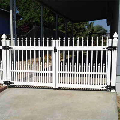 White picket driveway gates from our vinyl gate wholesaler near Pixley CA.